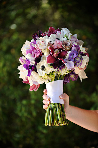 Beautiful wedding bouquet in white and purples
