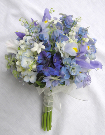 Blue wedding bouquet idea that includes pale iris delphinium