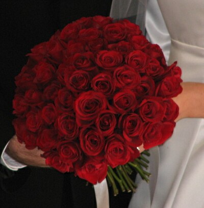 Large and abundant bold red roses bouquet perfect for a bride