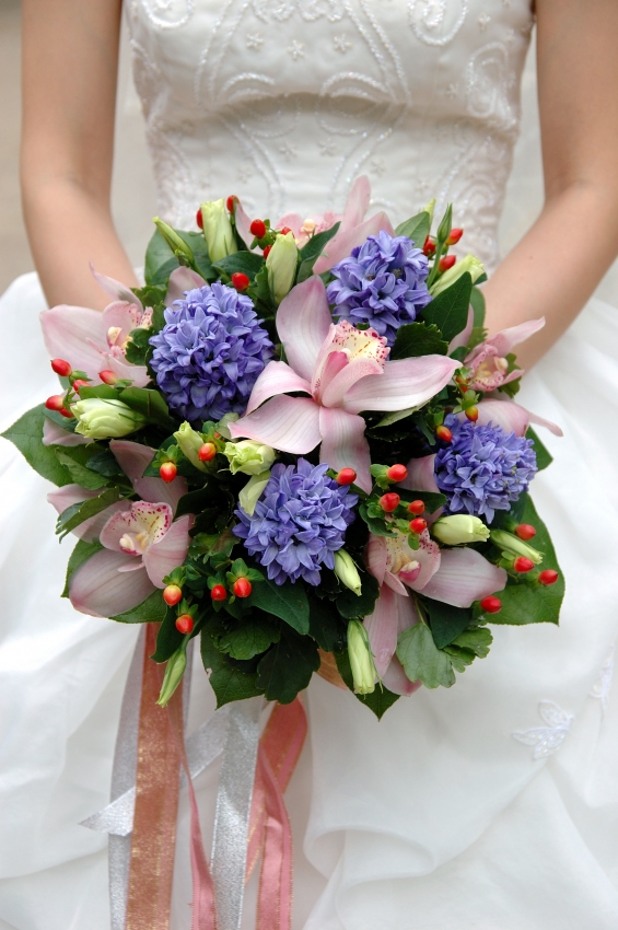 Pastel pink lilies with purple and green flowers