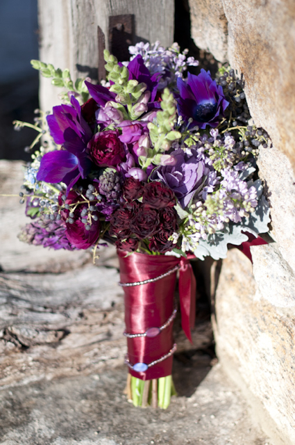 Beautiful bouquet for a bride made of purple lilac burgundy spray roses 