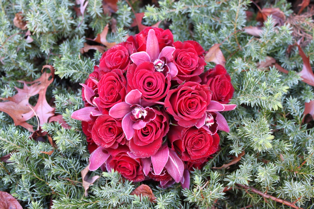 Lovely red roses with pink orchids bridal bouquet