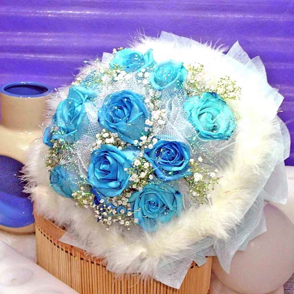 Excellent for a blue and white themed wedding blue roses bridal bouquet