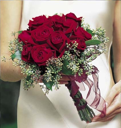 A stunning bouquet of red roses perfect for any blushing bride