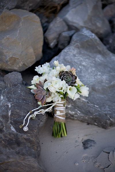 A perfect beach wedding with a stunning modern bouquet made up of white 