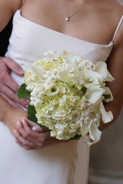 Beautiful white wedding flower bouquet created by Jacob Maarse Florists