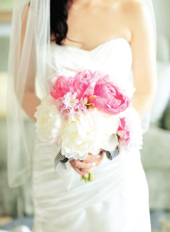 Stunning white and pink peonies hand tied with a striped black and white 