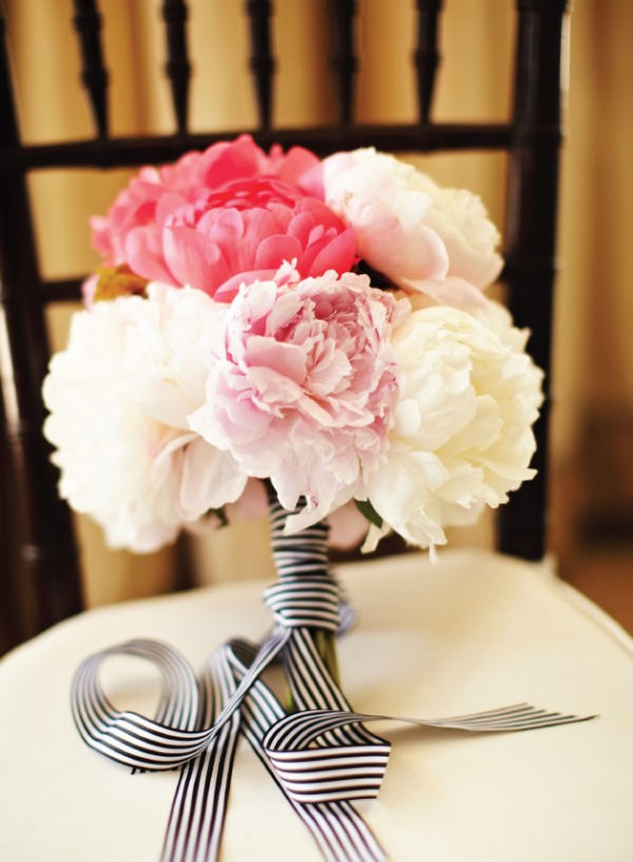 Stunning white and pink peonies hand tied with a striped black and white 