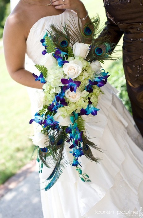 Beautiful bouquet with Peacock Feathers and blue and purple orchids