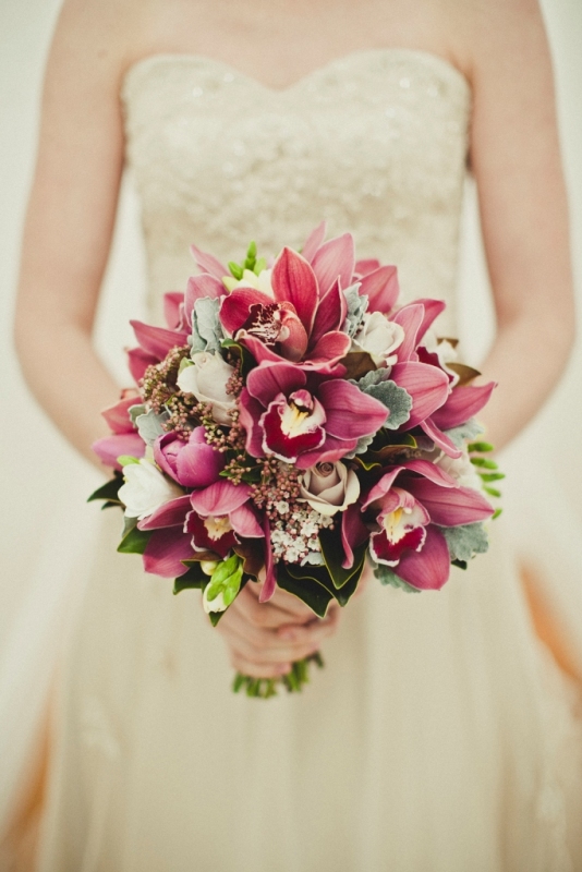 Burgundy cymbidium orchids creme de menthe and Metallina roses flowering 