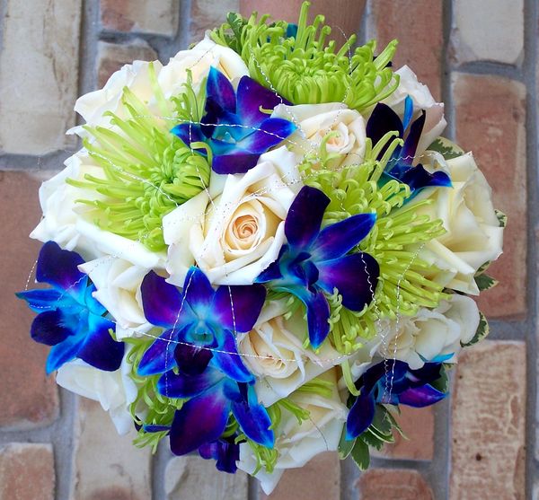 Enchanting Designer Bridal Bouquet of blue orchids and green Spider Mums 