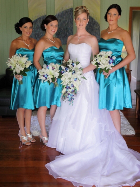 Beautiful bridal bouquet made of white lilies and blue orchids with gorgeous