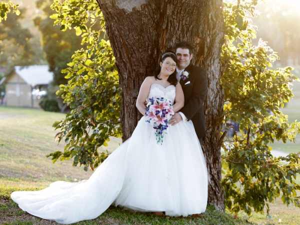 Beautiful bridal bouquet made of white lilies and blue orchids 