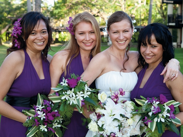 Unique purple and white wedding bouquet for the bridesmaids featured in a 