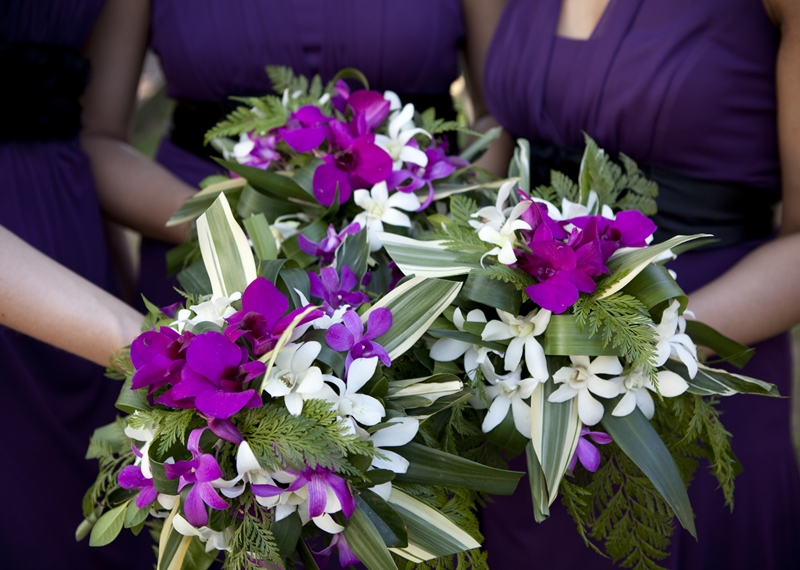 Unique purple and white wedding bouquet for the bridesmaids featured in a