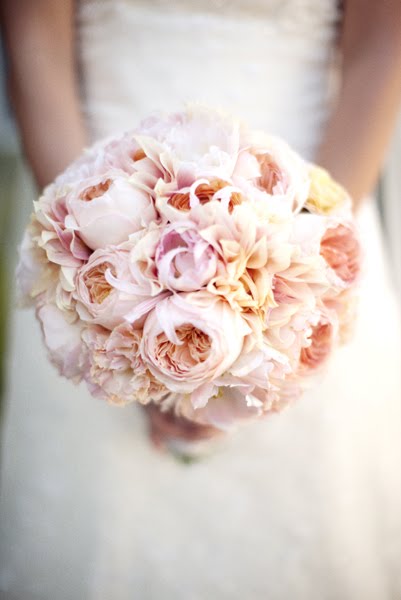 Beautiful unique blue and white bridal bouquet made up of white peonies and