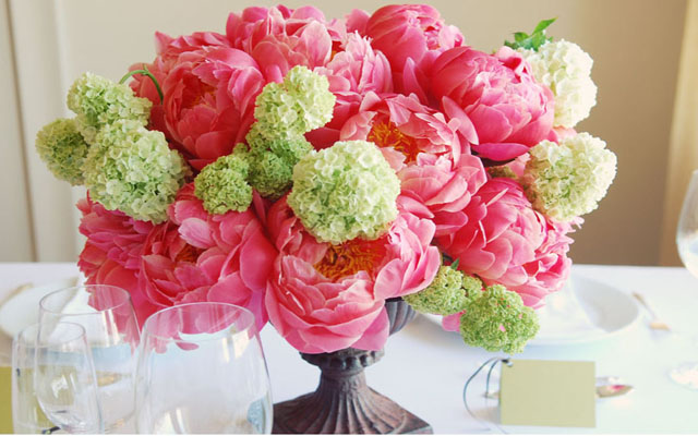 A table centrepiece with blue hydrangeas delphiniums 