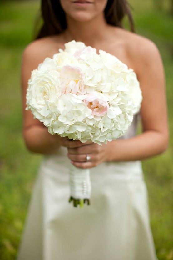 This bouquet is made up of peonies white hydrangeas and roses