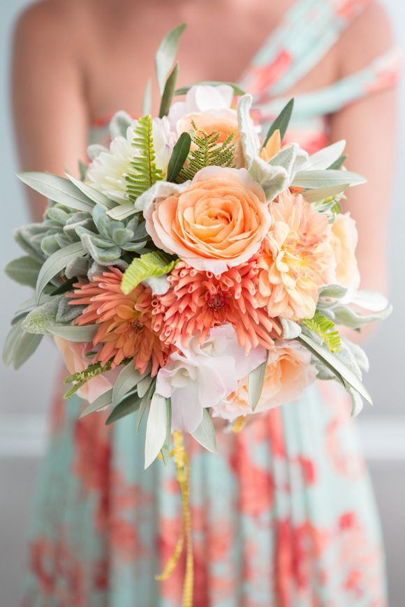 coral, peach and succulent bouquet color combination with the bridesmaid's dres