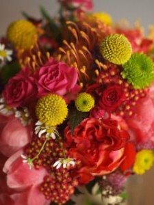 Bouquet of crispedia, orange prothea, red yarrow, green mums, pink peonies