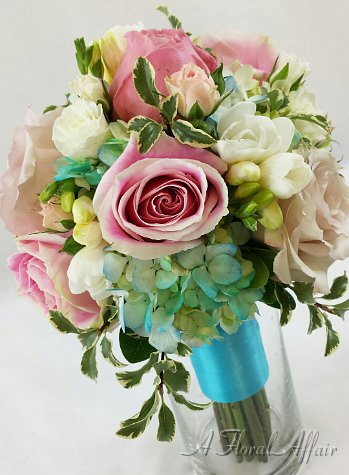 Pink and white bouquet with a touch of blue