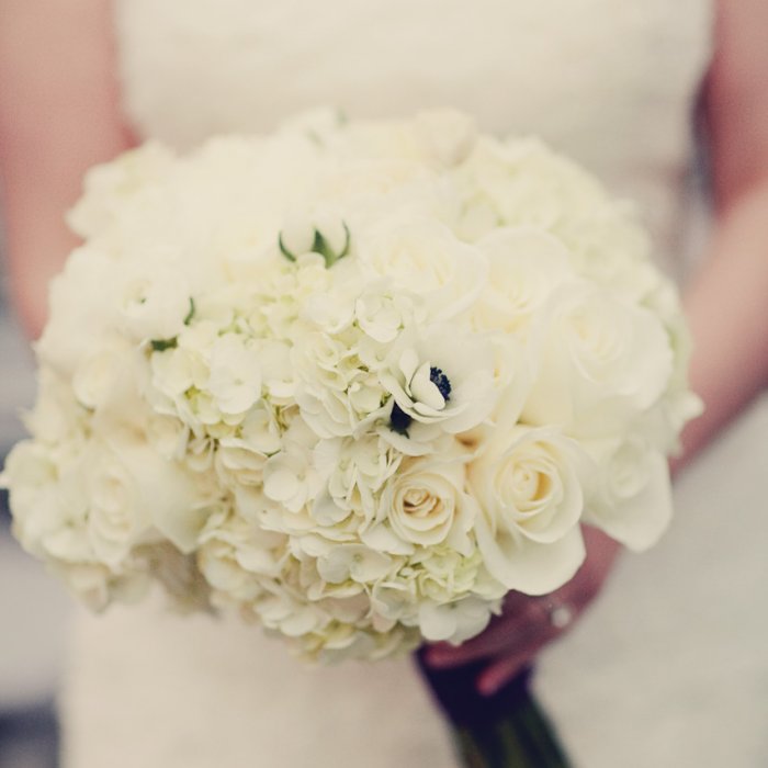 White Bridal Bouquet of peonies, roses, hydrangeas, ranunculus, and anemonies,