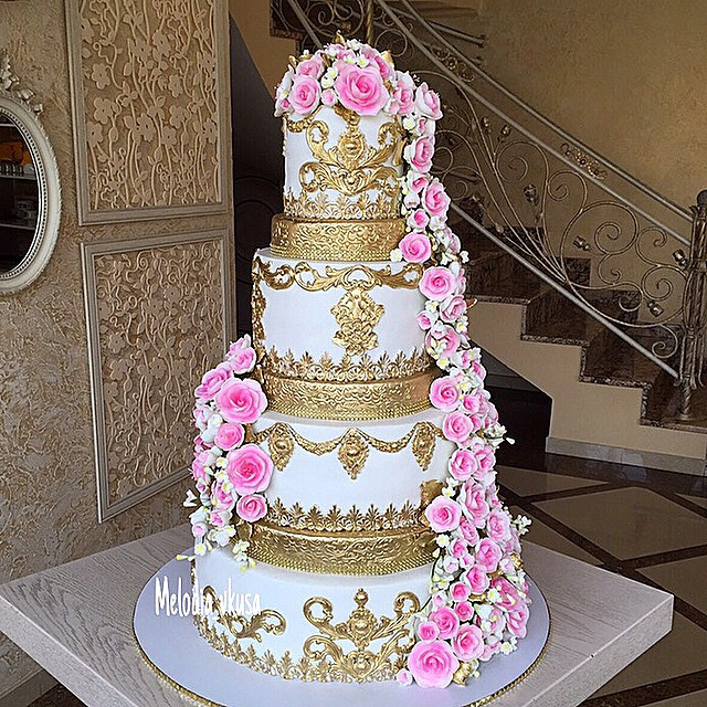 gold and pink traditional wedding cake