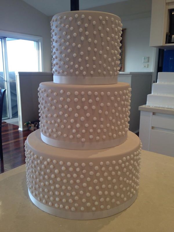 white dotty wedding cake