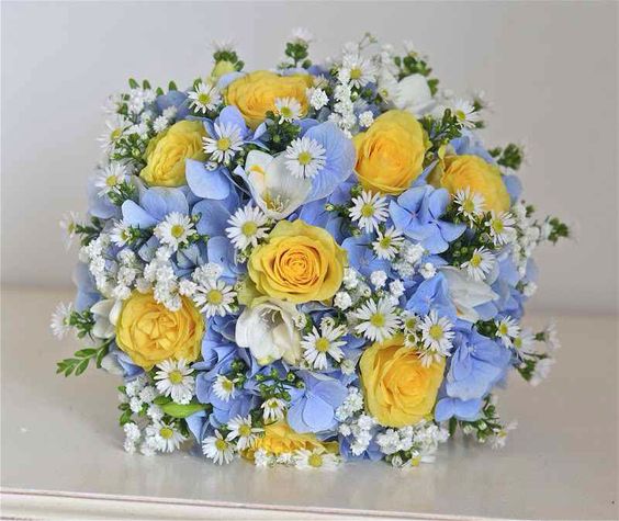 Blue hydrangeas and yellow roses