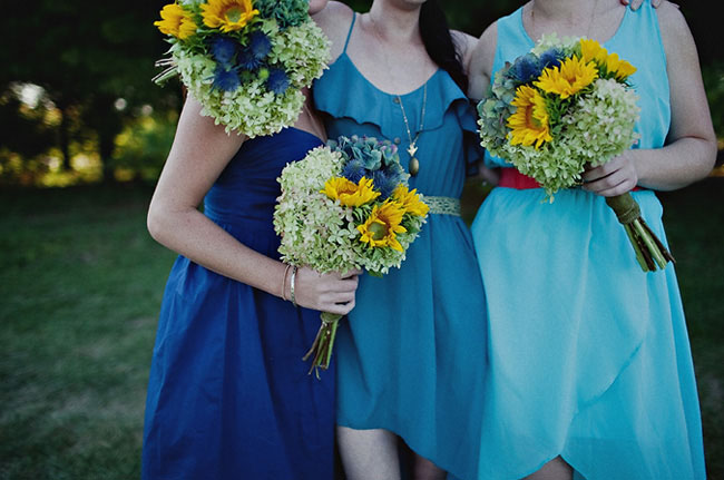 Bridesmaids bouquet of blue hydrangeas and sunflwoers