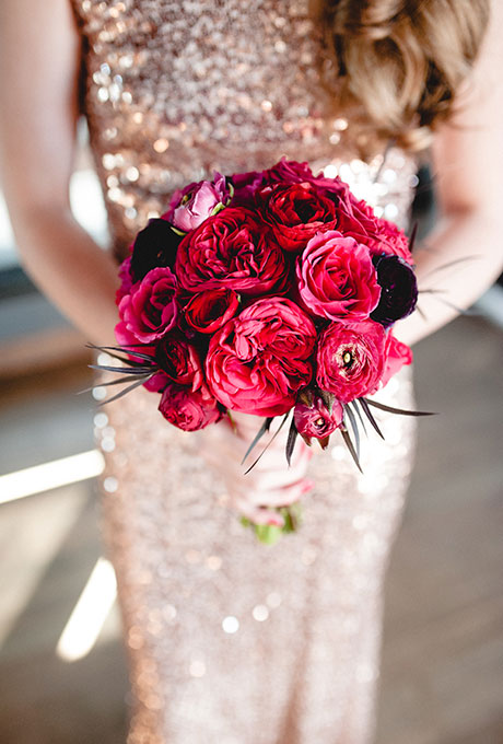 Bridal bouquet of garden roses, peonies, and anemones with black accents