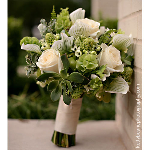 Lady Slipper orchid boutonniere with poppy pods, reindeer moss succulents