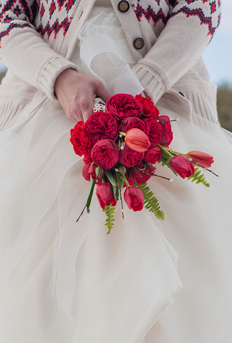 Red bouquet of garden roses and tulips