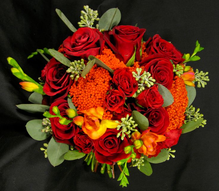 Red rose, orange freesia and orange yarrow bouquet