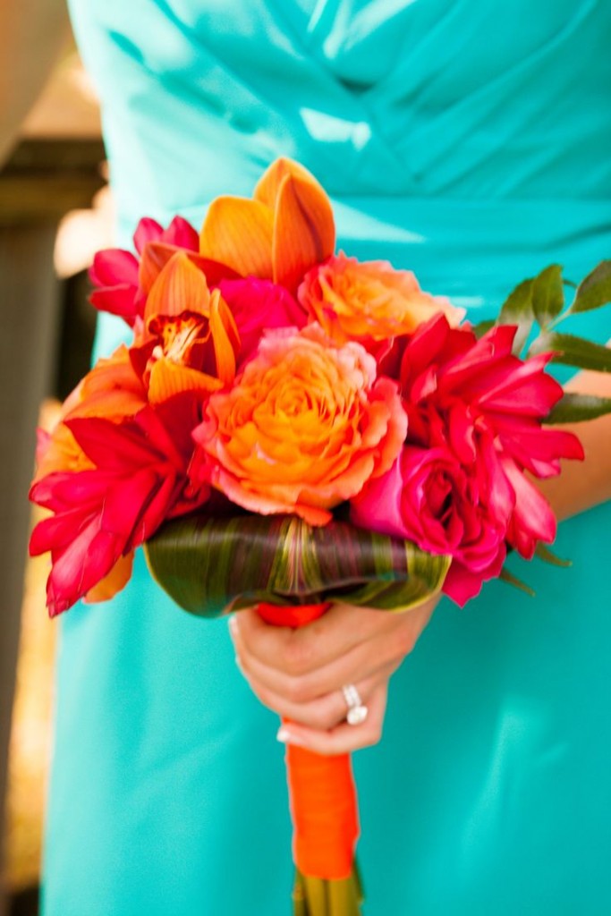 Bouquet made of orange chile roses, kiko fuschia roses, red ginger, cymbidium orchids